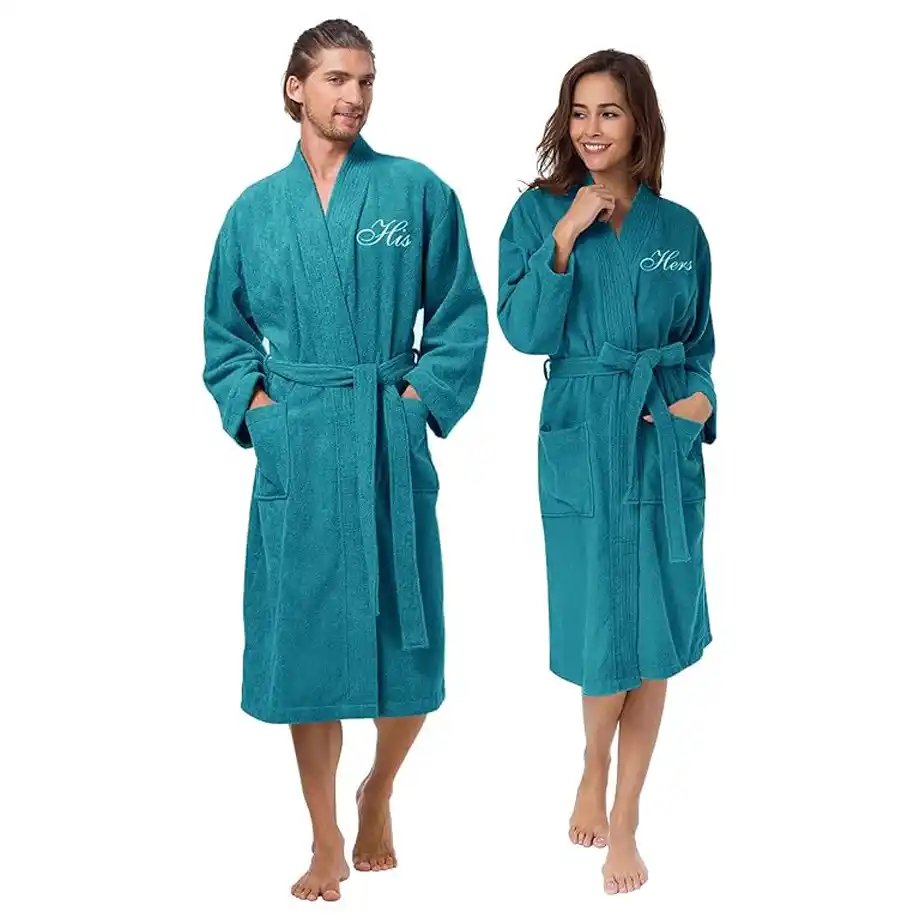 A luxurious set of matching his and hers cotton bathrobes, ideal for couples. A cozy and thoughtful engagement gift idea for newlyweds or soon-to-be-married couples.