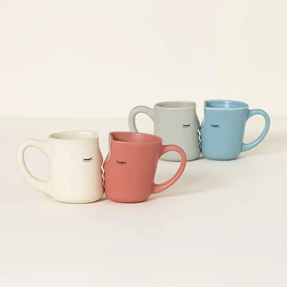 A set of uniquely designed kissing mugs that fit together perfectly, symbolizing love and connection. A charming and romantic option for engagement gift ideas, perfect for newly engaged couples.