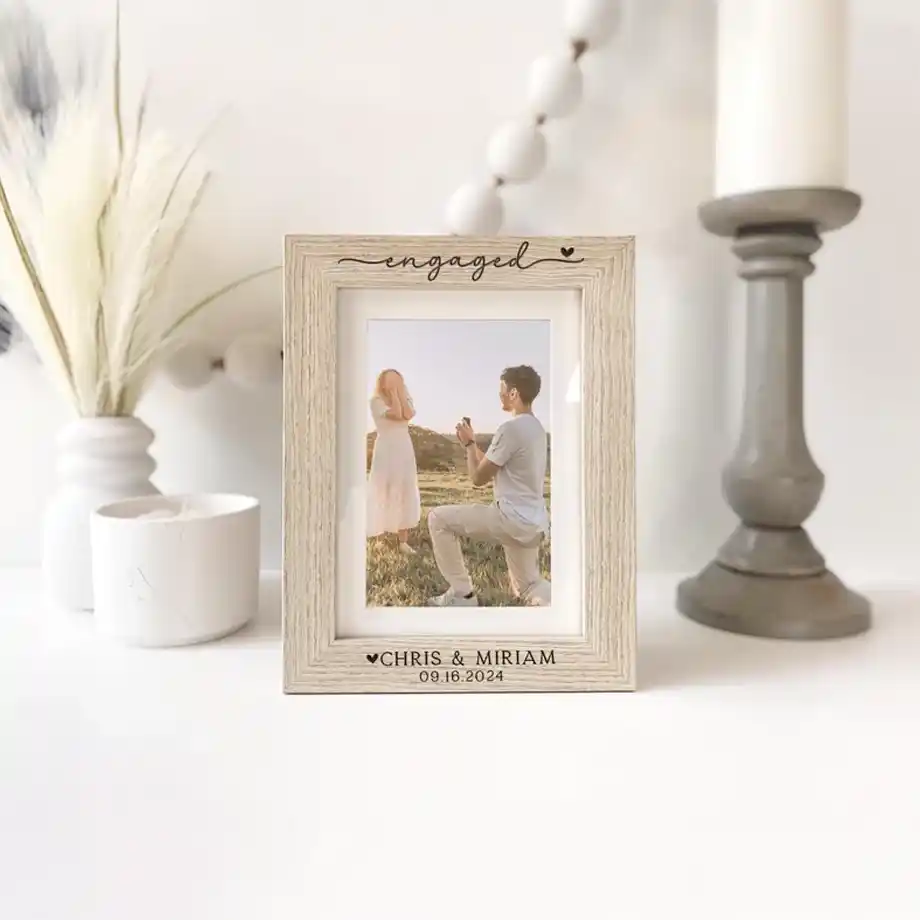 A beautifully crafted personalized picture frame designed for engaged couples, perfect for showcasing their special moments. A thoughtful and sentimental choice for engagement gift ideas.