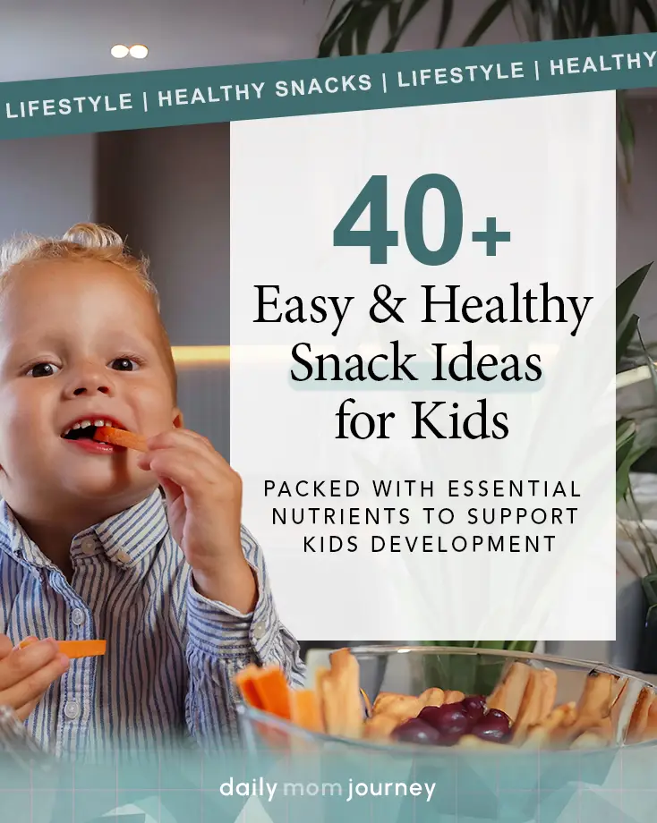 Smiling toddler eating healthy snacks for kids, including carrots, grapes, and other fresh options, showing how easy healthy eating can be.