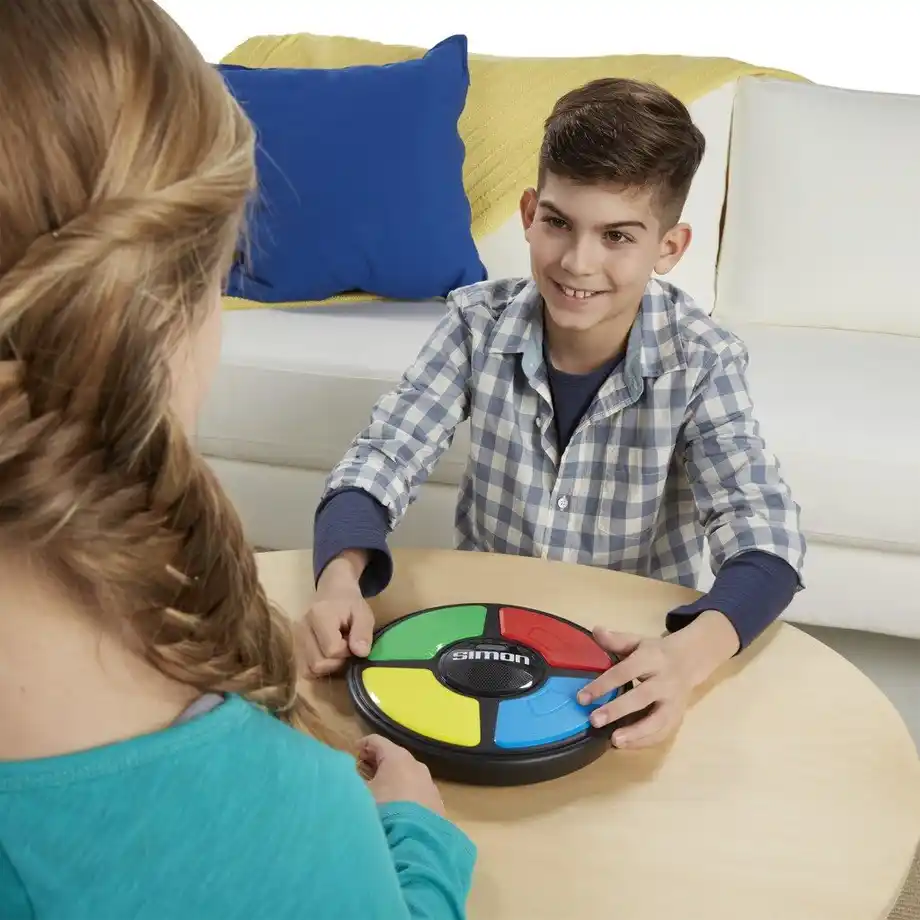 The classic Hasbro Simon Electronic Game featuring colorful light-up buttons, perfect for indoor games that test memory, focus, and reflexes for kids and adults.