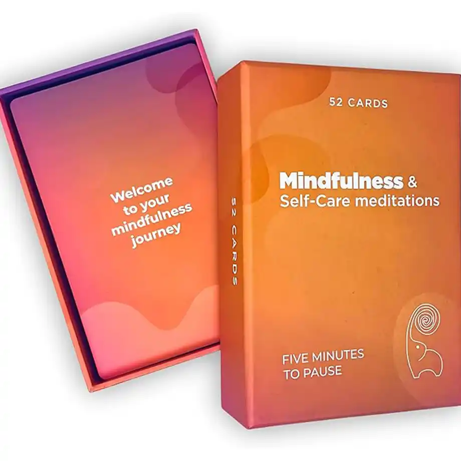 A soothing flat lay featuring self-care meditation cards, a calming candle, and a self-care quotes, promoting relaxation and mindfulness. Soft lighting and warm tones create a tranquil, reflective atmosphere.