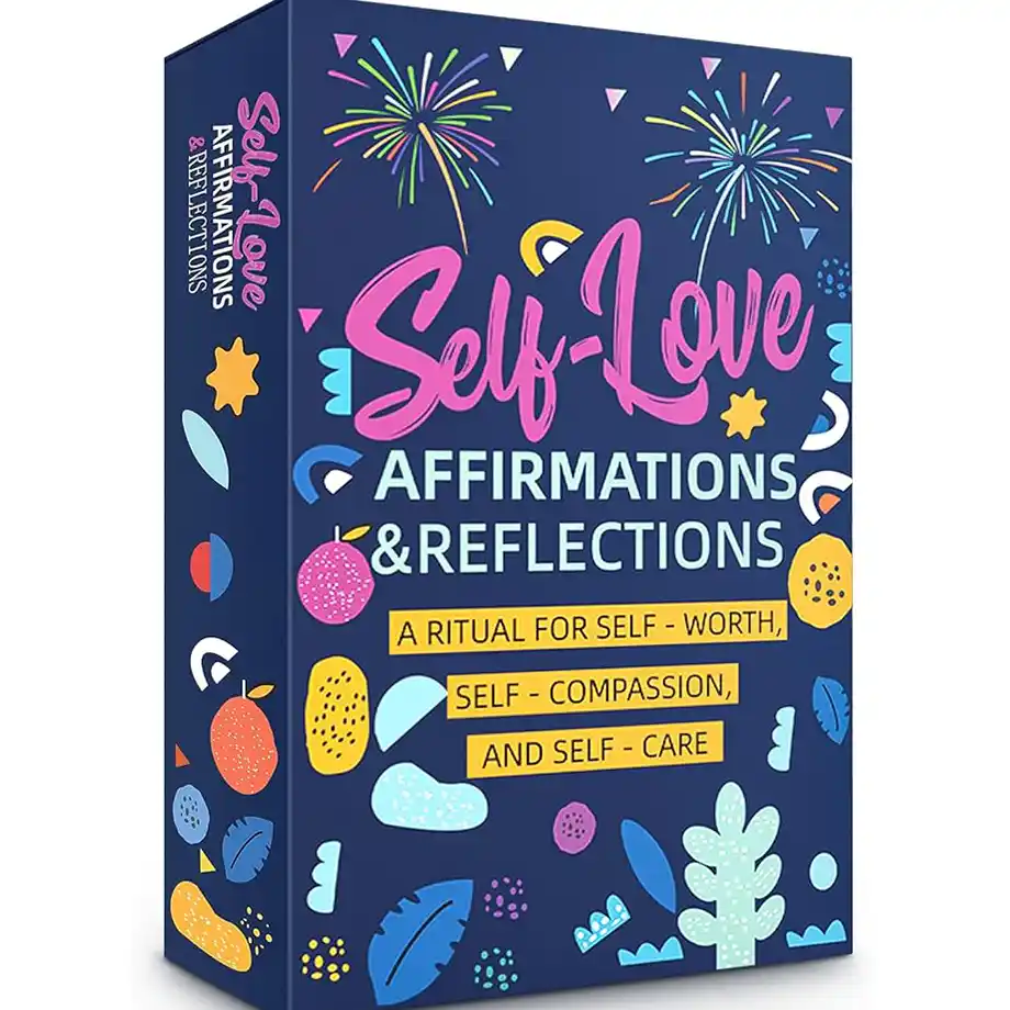 A beautifully arranged flat lay featuring self-love affirmation cards, a candle, and a self-care quotes, promoting positivity and self-compassion. Soft lighting and warm tones create a soothing, uplifting atmosphere.